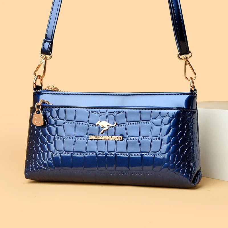 bolsa clutch feminina, bolsa feminina elegante, bolsa feminina sofisticada, bolsa crocodilo feminina, bolsa feminina envernizada, clutch feminina preta, clutch feminina azul, clutch feminina vermelha, bolsa feminina café, bolsa tiracolo feminina elegante, bolsa feminina pequena, bolsa feminina moderna, bolsa feminina premium, bolsa feminina social, clutch feminina luxo, bolsa feminina brilho, bolsa feminina compacta, bolsa feminina transversal, bolsa feminina textura crocodilo, bolsa feminina casual chic, b