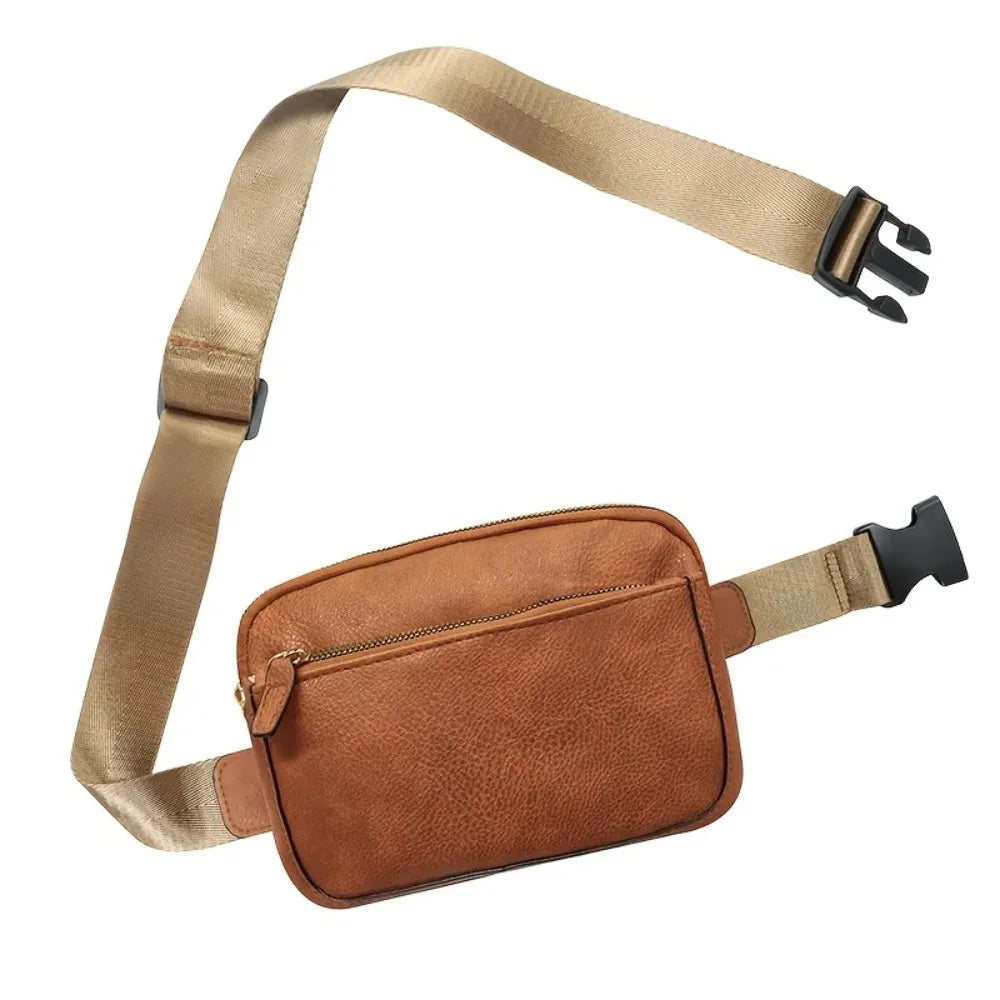Bolsa Feminina Tipo Pochete Julia compacta, moderna e prática. Modelo transversal com alça ajustável, perfeita para o dia a dia, viagens e passeios.